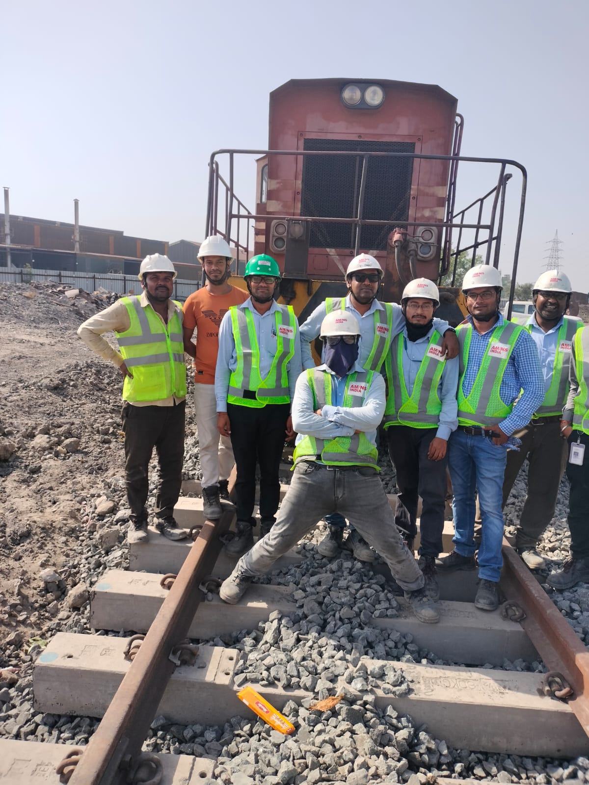 Meera Construction site team in high-visibility PPE at a rail yard